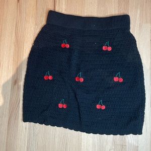 Black crochet skirt with cherries